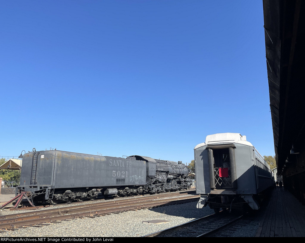 SF # 5021 Steam locomotive on left and Cal State RR Museum Excursion Train on right 